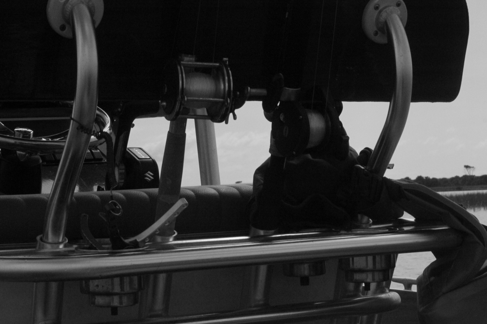 Fishing rods and reels rigged aboard a skiff